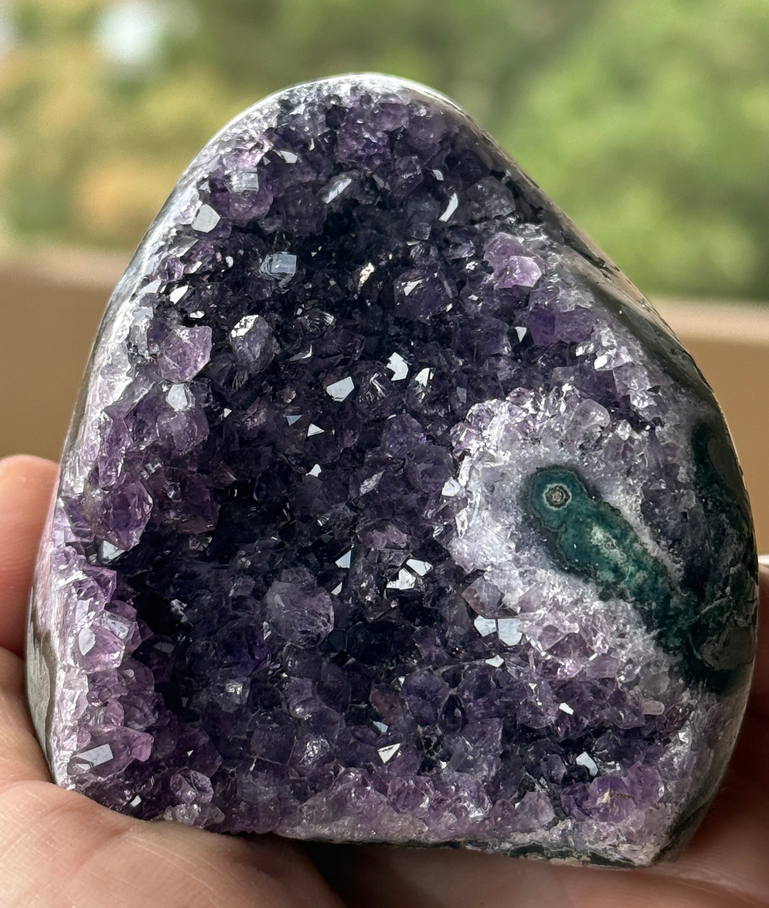Polished amethyst stalactite slice with visible stalactite core and purple druzy crystals. Natural geode specimen for collectors and décor.
