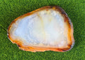 Geode slice on a green grass background